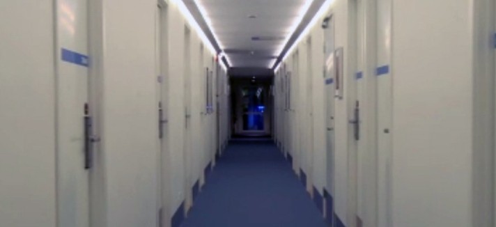 the-long-hallway-leading-to-the-rooms
