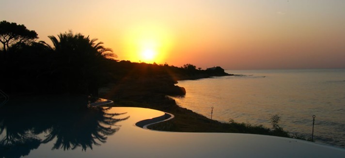 Sunrise-over-the-amazing-infinity-pool-in-the-private-beach-at-hotel-costa-dei-fiori-on-the-sout