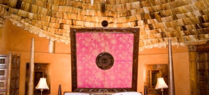 but-the-real-centerpiece-of-the-suite-is-the-bed-its-directly-under-the-banana-bark-roof-and-has