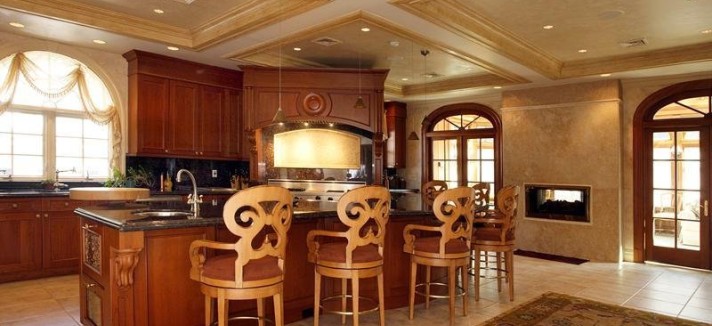 the-kitchen-feels-very-cozy-we-love-the-fireplace-near-the-island