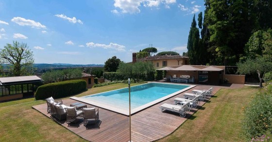 This gorgeous villa sits on a hill overlooking the city of Florence