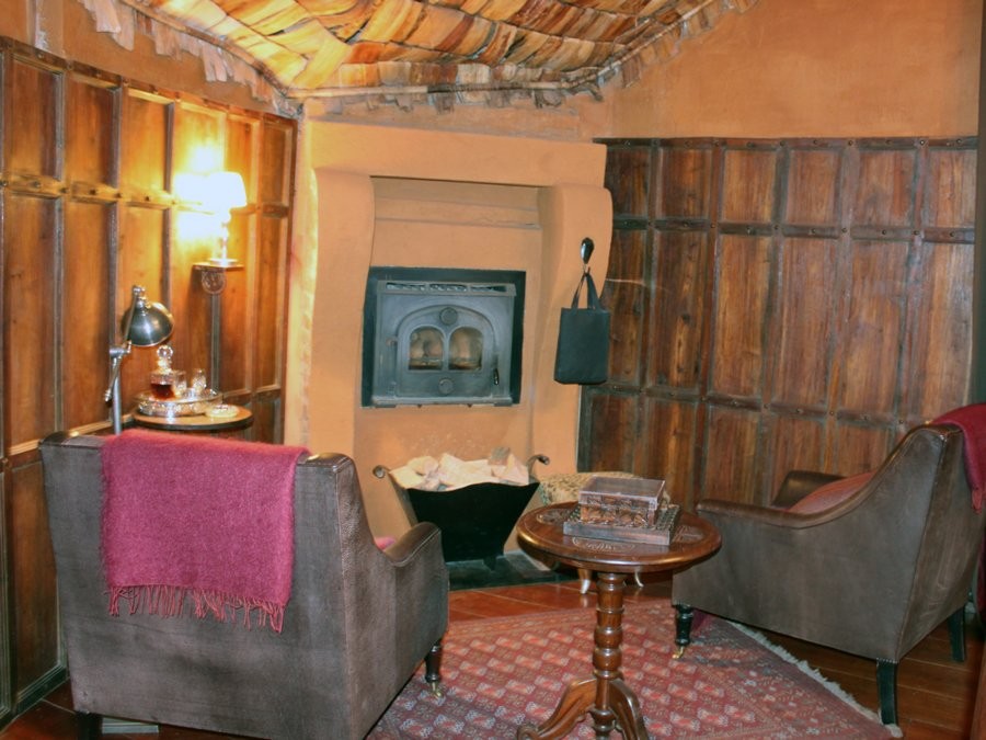 inside-the-room-theres-a-sitting-area-with-leather-armchairs-and-a-fireplace-when-i-got-back-to-