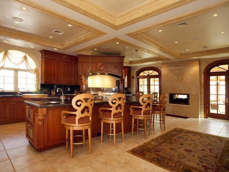 the-kitchen-feels-very-cozy-we-love-the-fireplace-near-the-island