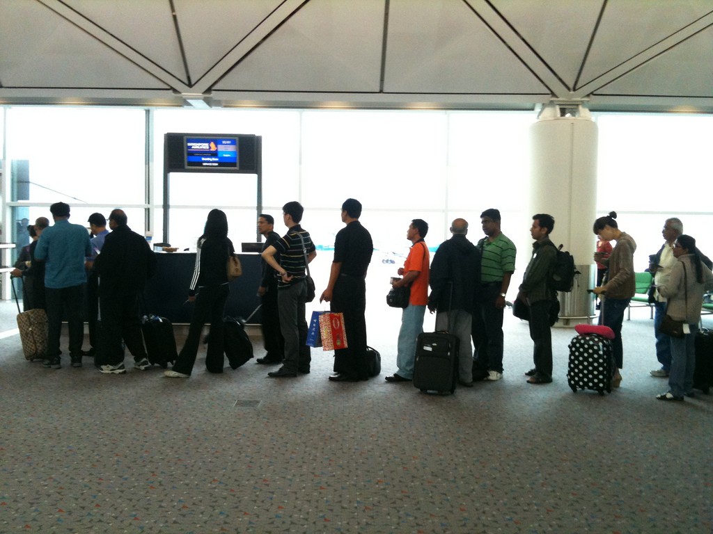 You'll have to queue up in the longer line at the airport / Flickr