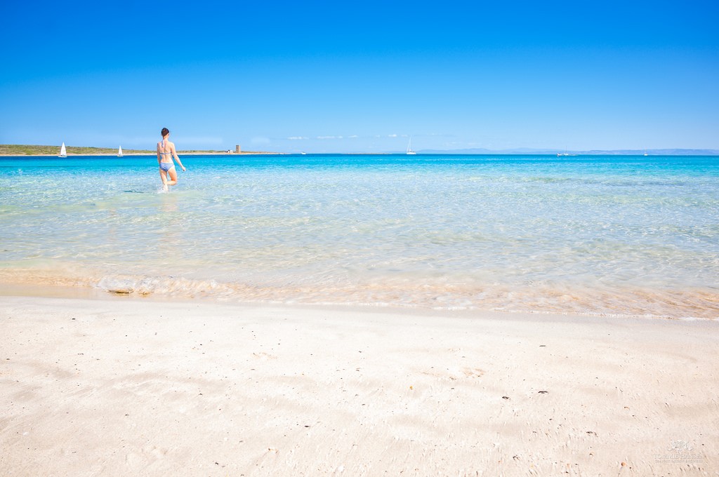 The beach at La Pelosa in Sardinia, Italy is still a wonderful place to go on holiday after Brexit / Flickr