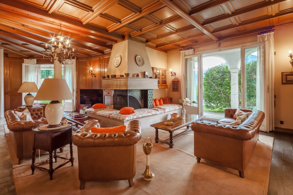 The living room has a homely, central fireplace