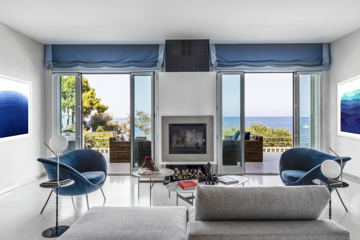 The living room with fireplace feature opens directly onto the terrace The living room with fireplace feature opens directly onto the terrace