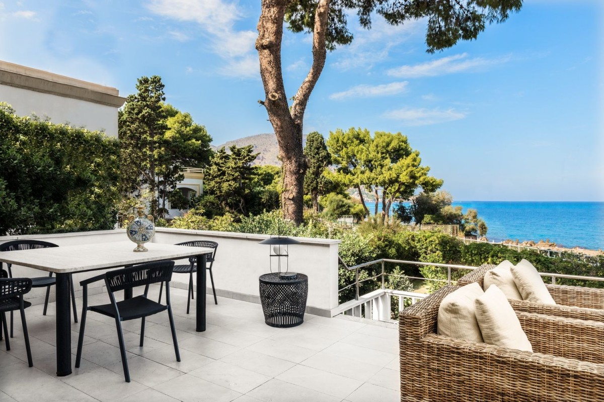 The villa has a spacious outdoor terrace and garden area The villa has a spacious outdoor terrace and garden area