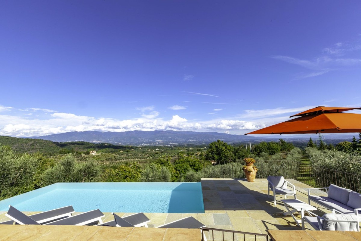 A beautiful pool overlooks the rolling countryside
