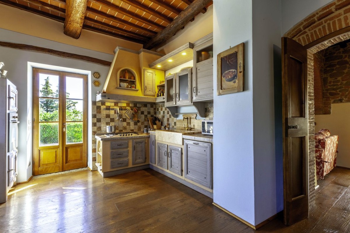 The traditional kitchen is spacious and bright