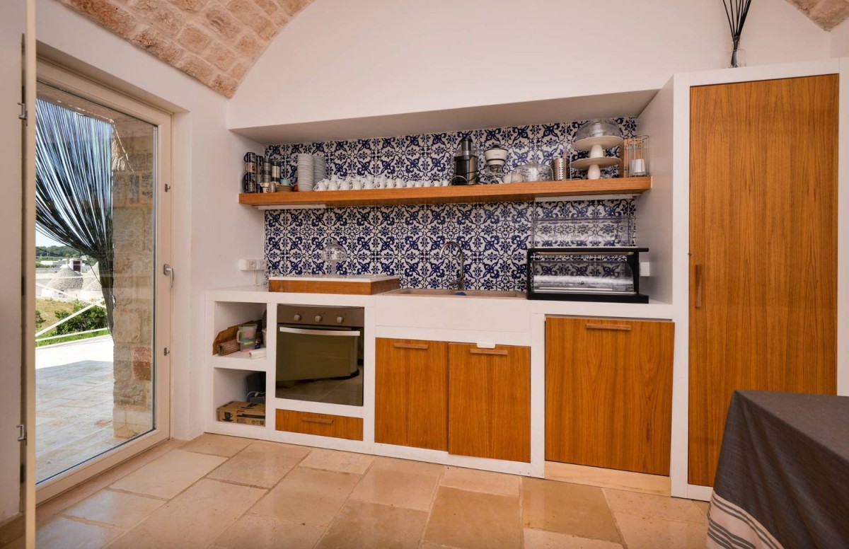 The kitchen is completed with local tiles 