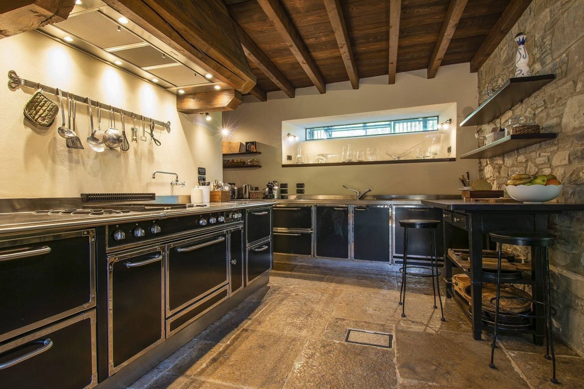 The kitchen has a unique modern design with traditional elements