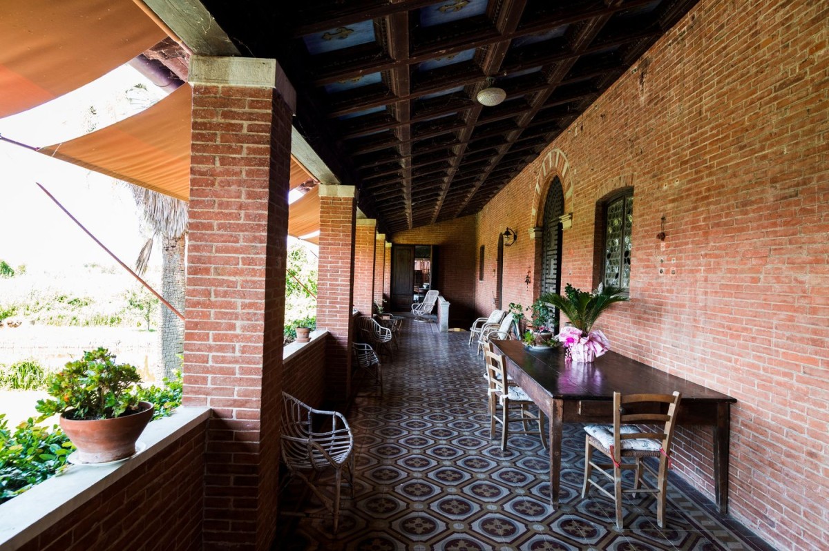 The long porch in the front of the villa