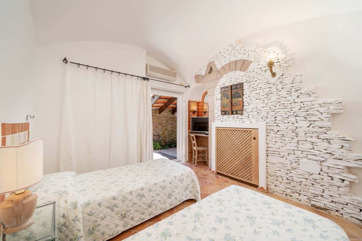 The bedrooms feature traditional stone details
