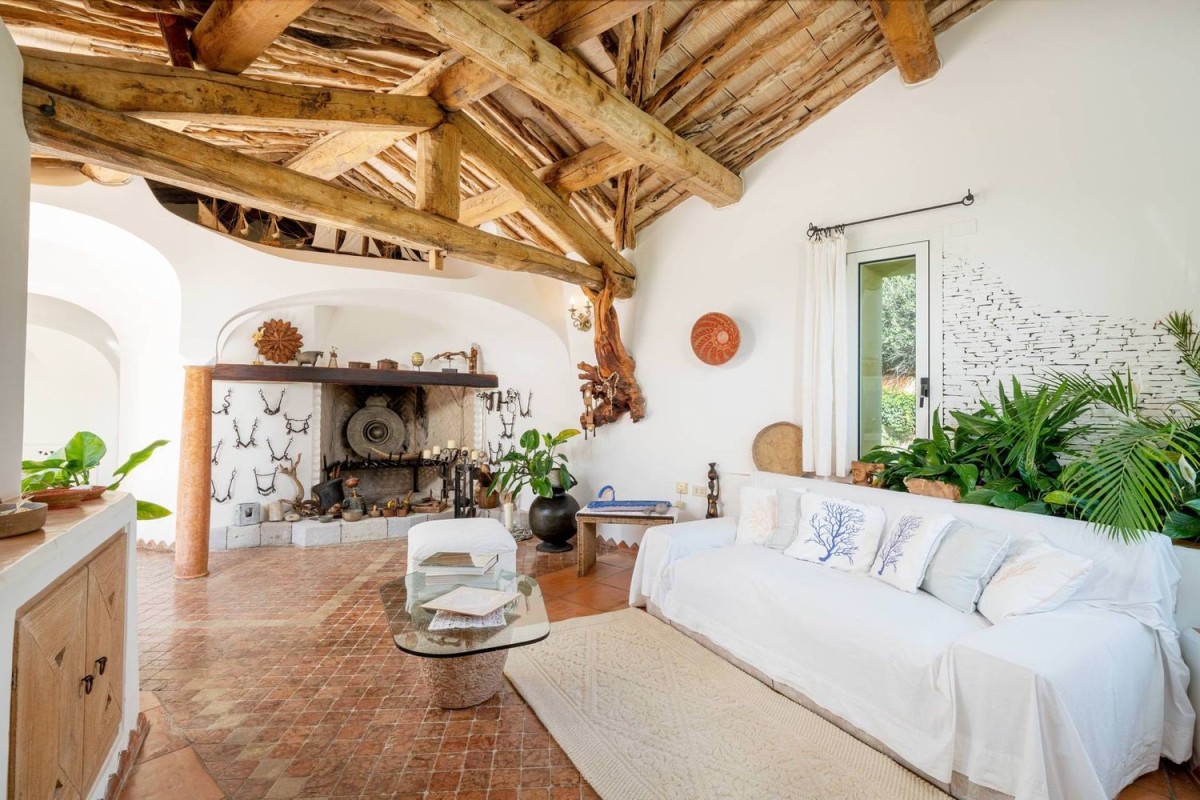 The living spaces feature exposed beams and fireplaces