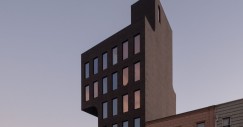 L'edificio si sviluppa verso l'alto mediante un volume a sbalzo che si estende lateralmente